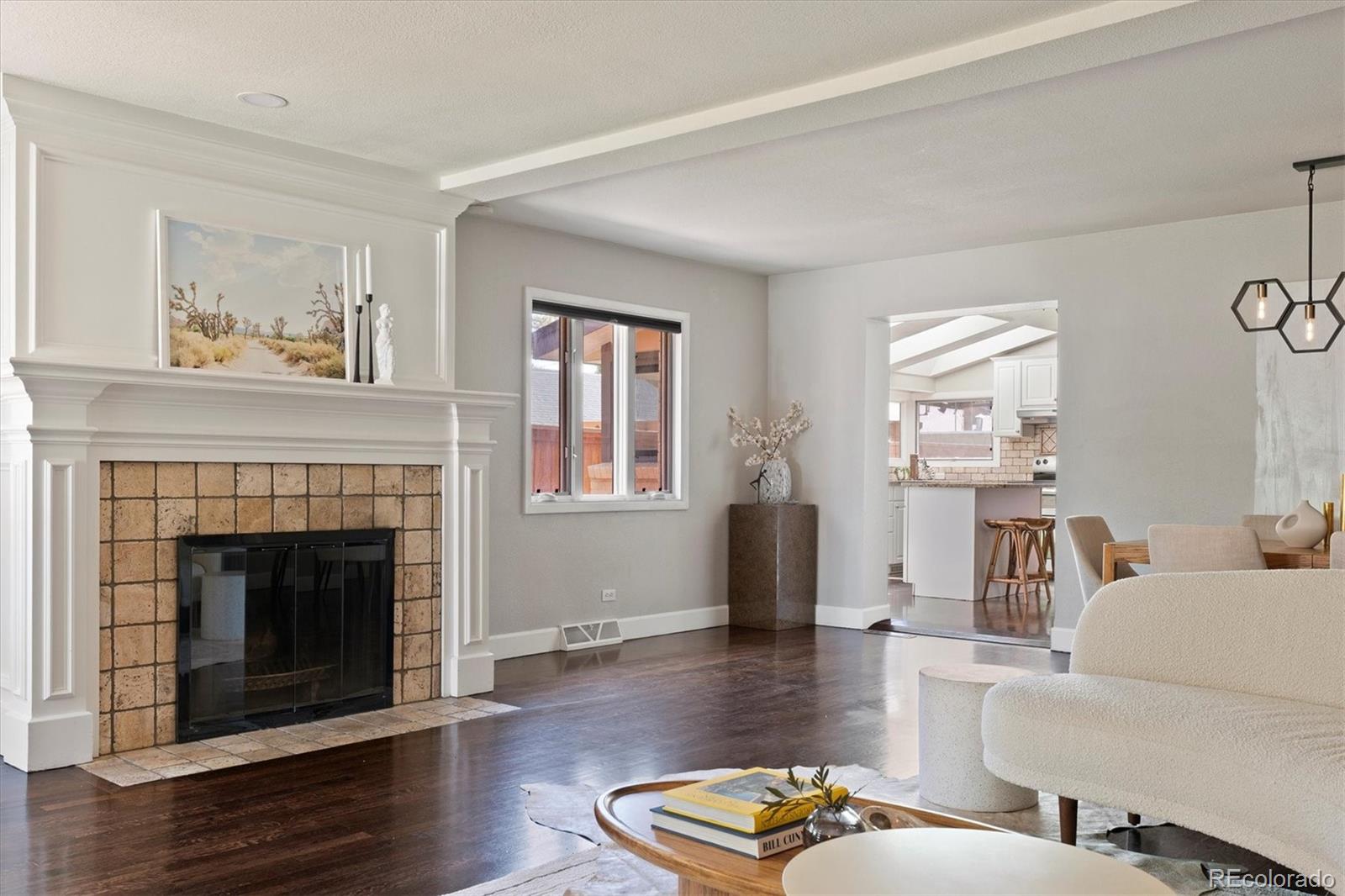1643 South Ogden Street Denver, CO 80210 - Photo 6 of 39 a living room with furniture and a fireplace