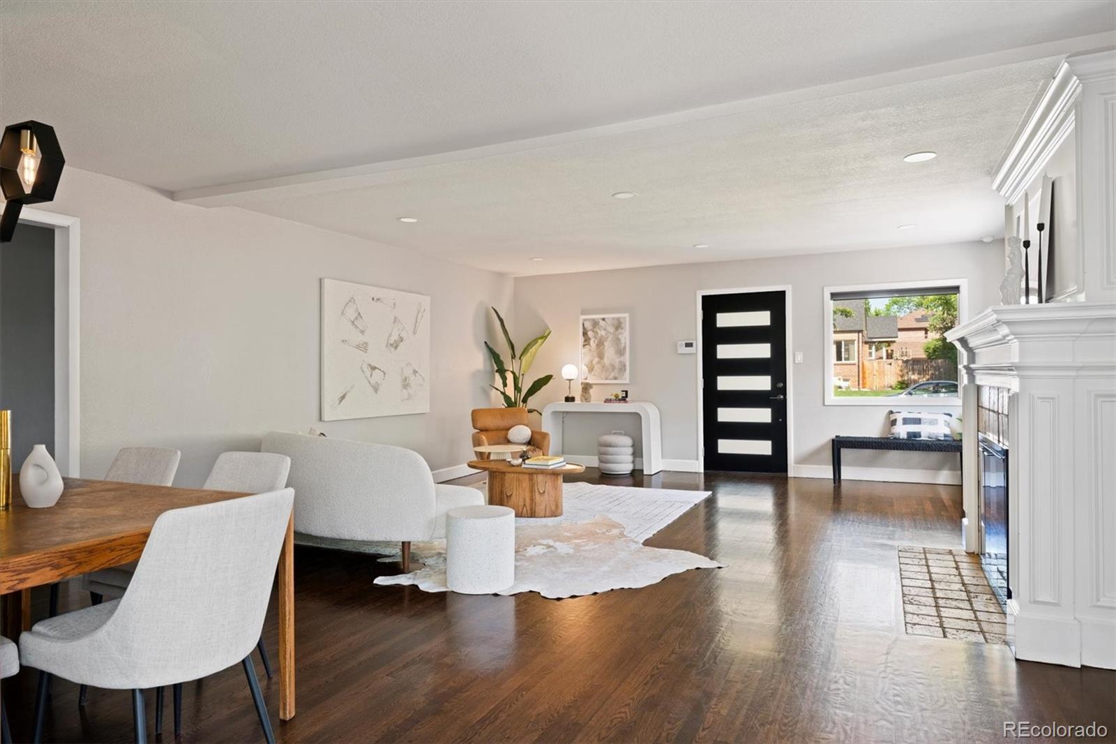 1643 South Ogden Street Denver, CO 80210 - Photo 8 of 39 a living room with furniture and a wooden floor