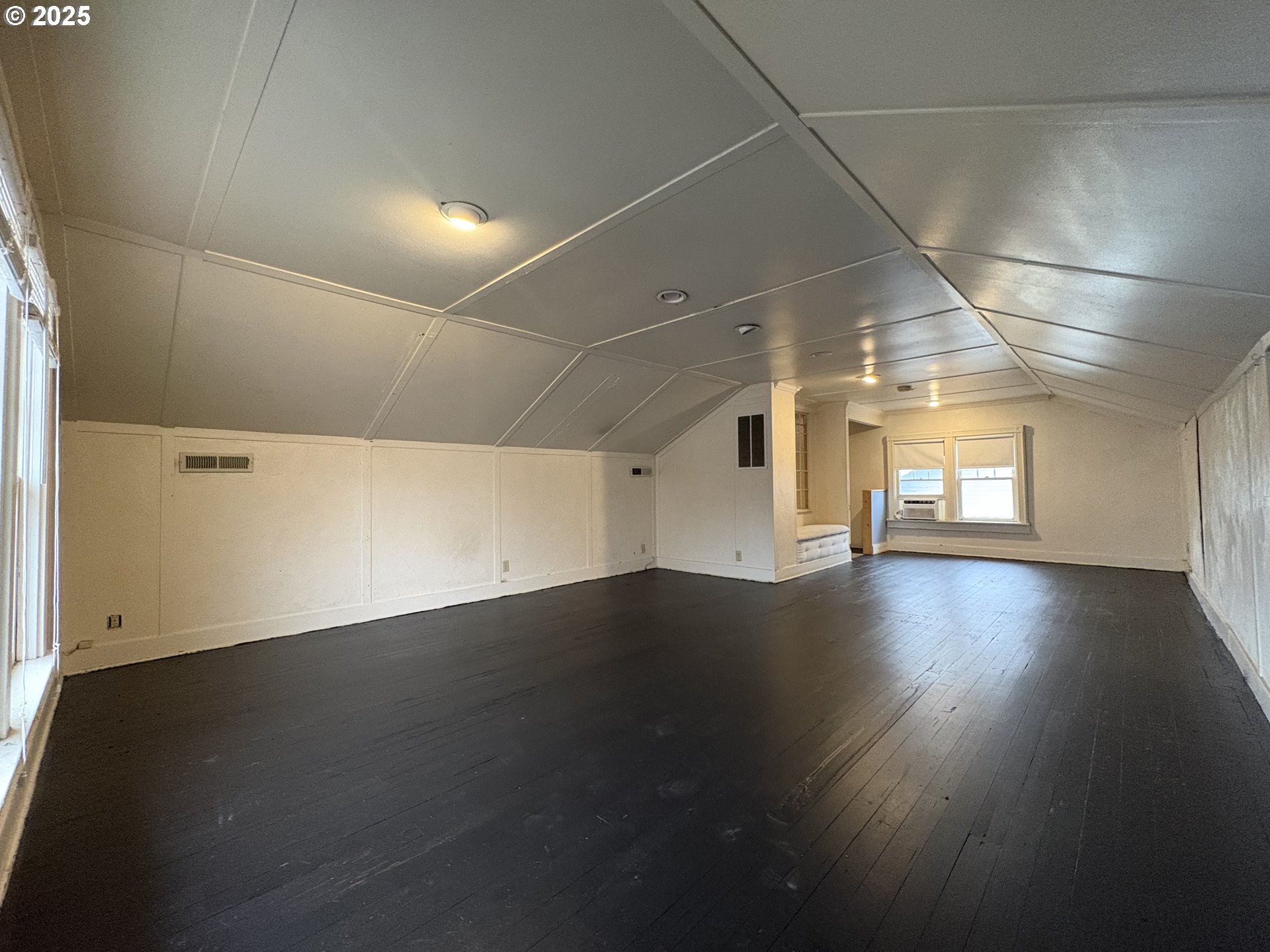 960-970 West 7th Avenue Eugene, OR 97402 - Photo 11 of 22 an empty room with wooden floor and windows