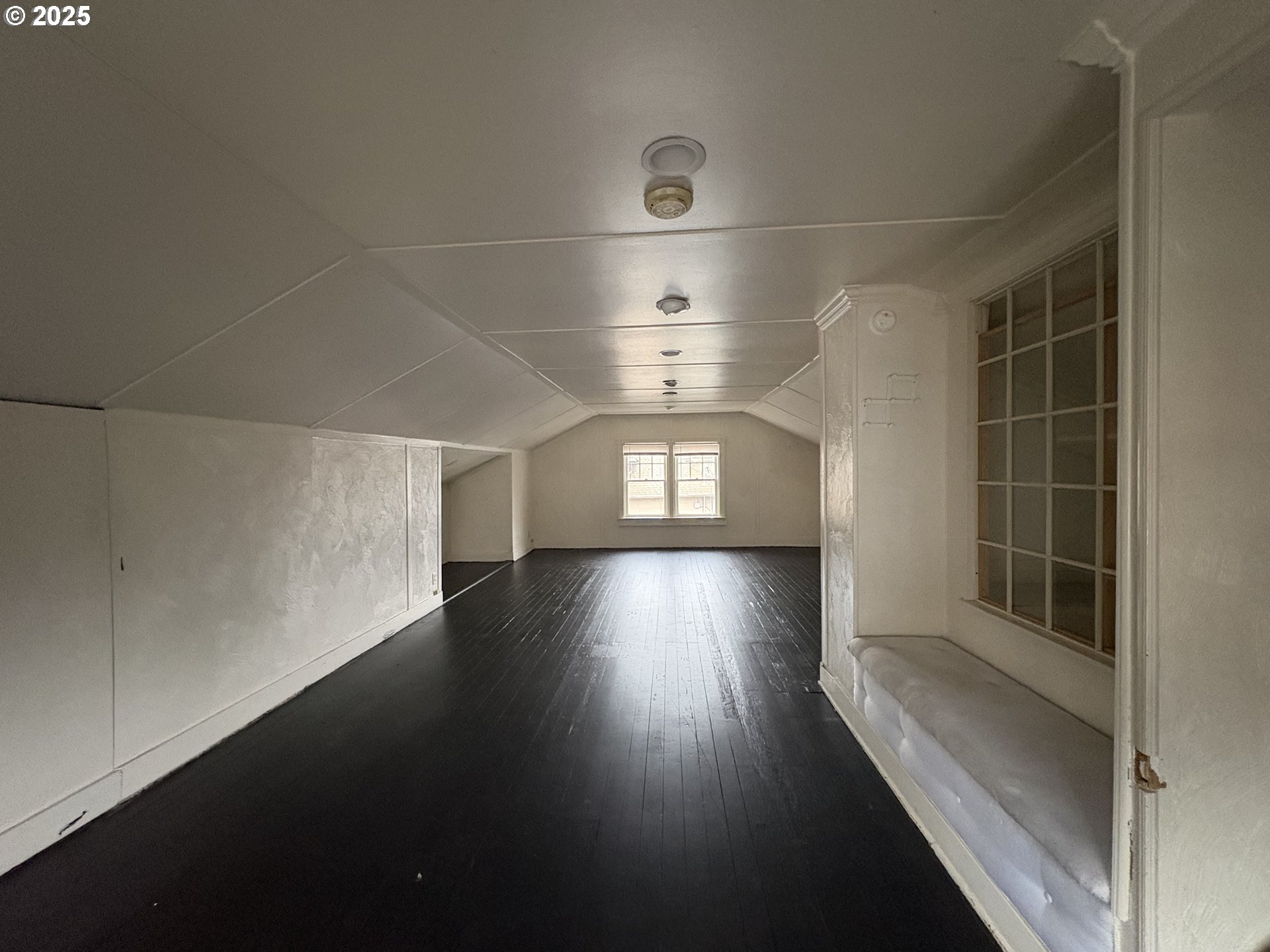 960-970 West 7th Avenue Eugene, OR 97402 - Photo 12 of 22 an empty room with wooden floor and windows