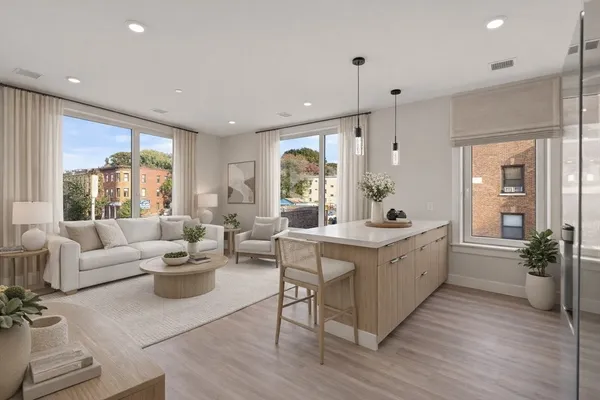 a large white kitchen with a large window