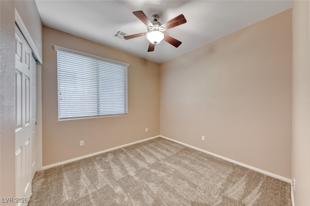 2764 Craigmillar Street Henderson, NV 89044 - Photo 18 of 24 Bedroom with ceiling fan and new carpet.