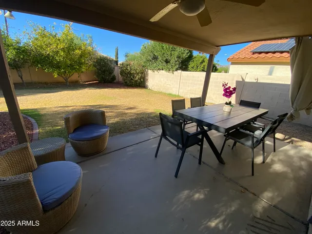 a view of an outdoor sitting area with furniture