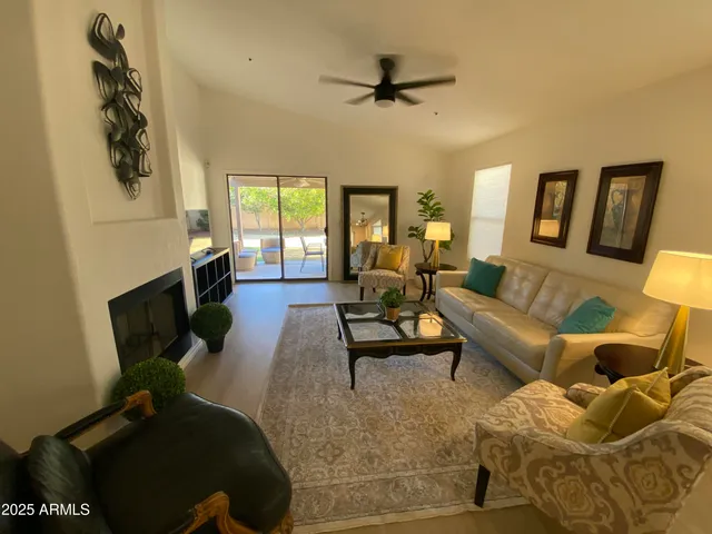 a living room with furniture and a window
