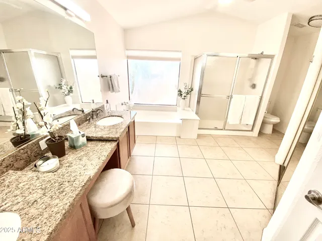 a living room with hard wood floor furniture and a table