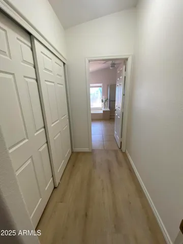 a view of a hallway view with staircase