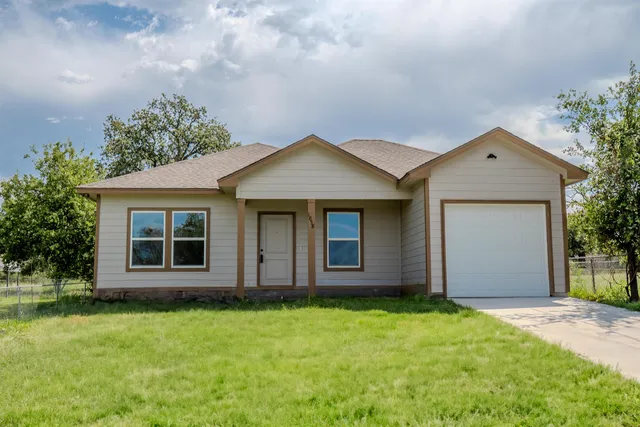 front view of a house with a yard