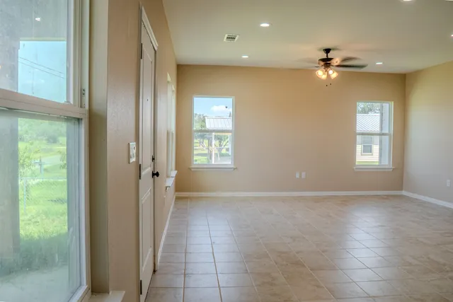 a view of an empty room with a window