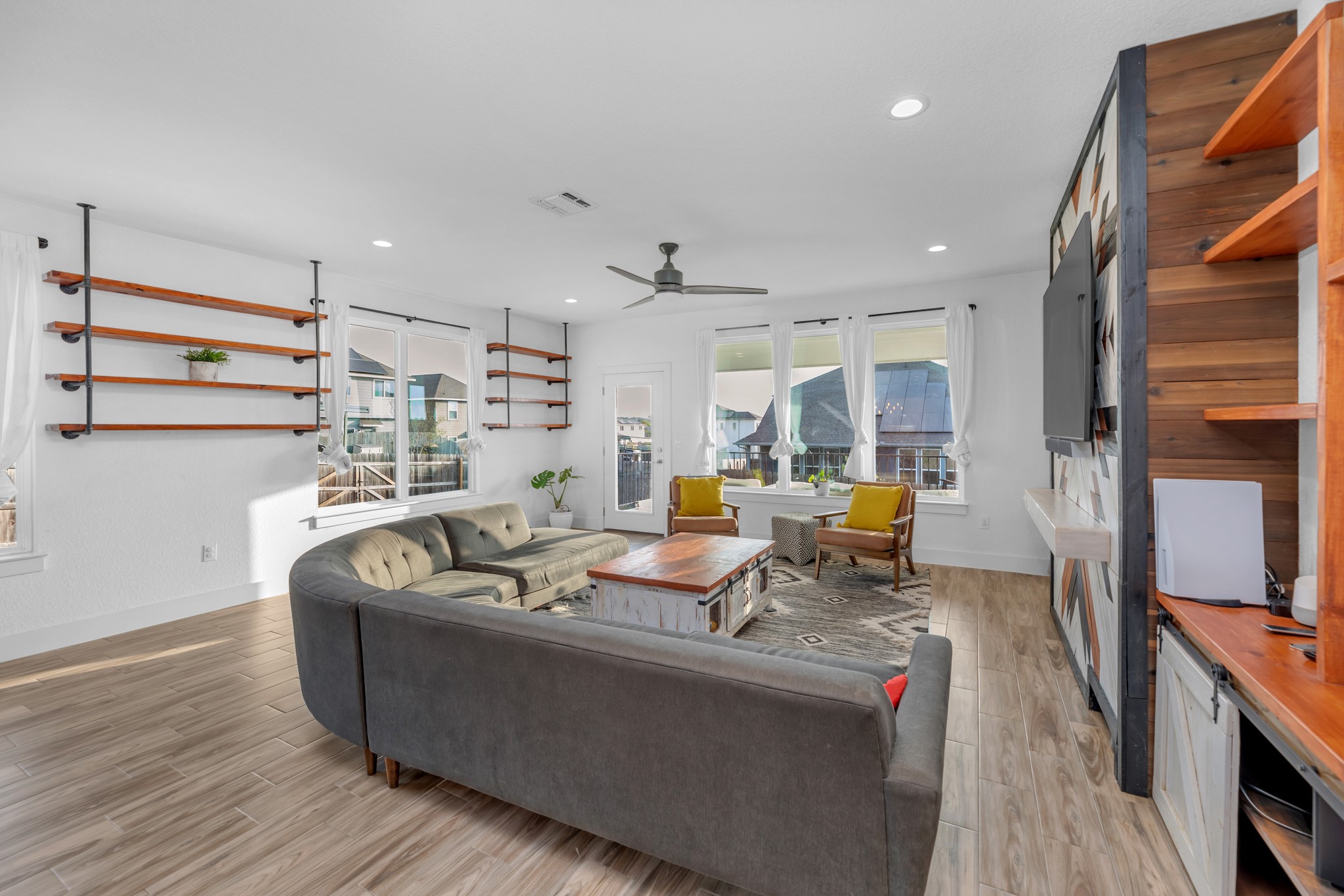 16512 Fetching Avenue Manor, TX 78653 - Photo 6 of 39 Living area featuring a wealth of natural light, visible vents, and light wood finished floors