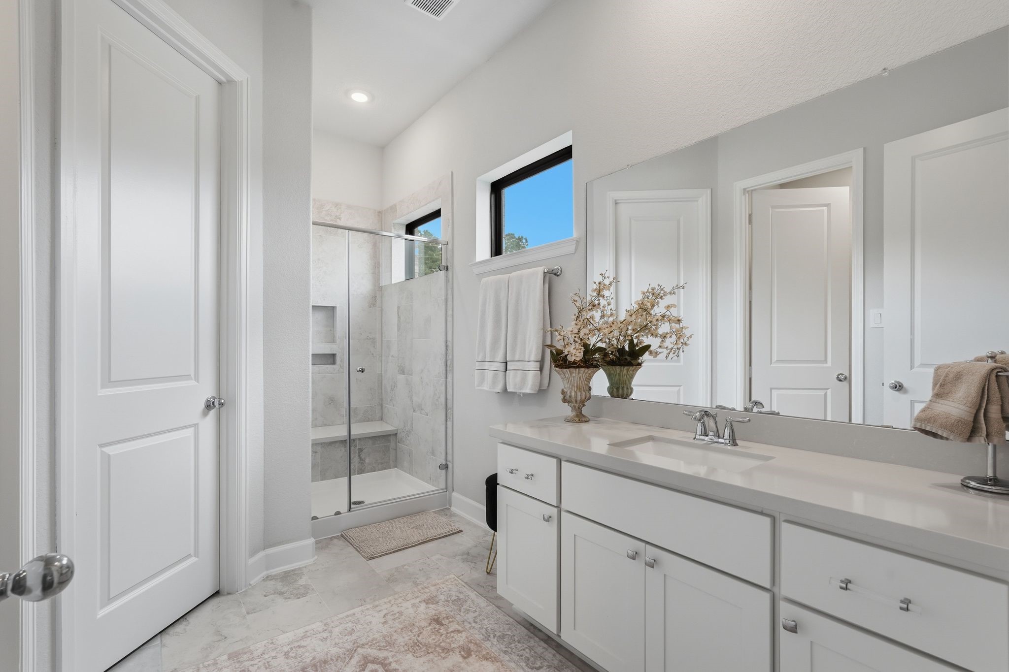 25011 Oxbow Lake Lane Spring, TX 77389 - Photo 24 of 33 a bathroom with a shower sink and mirror
