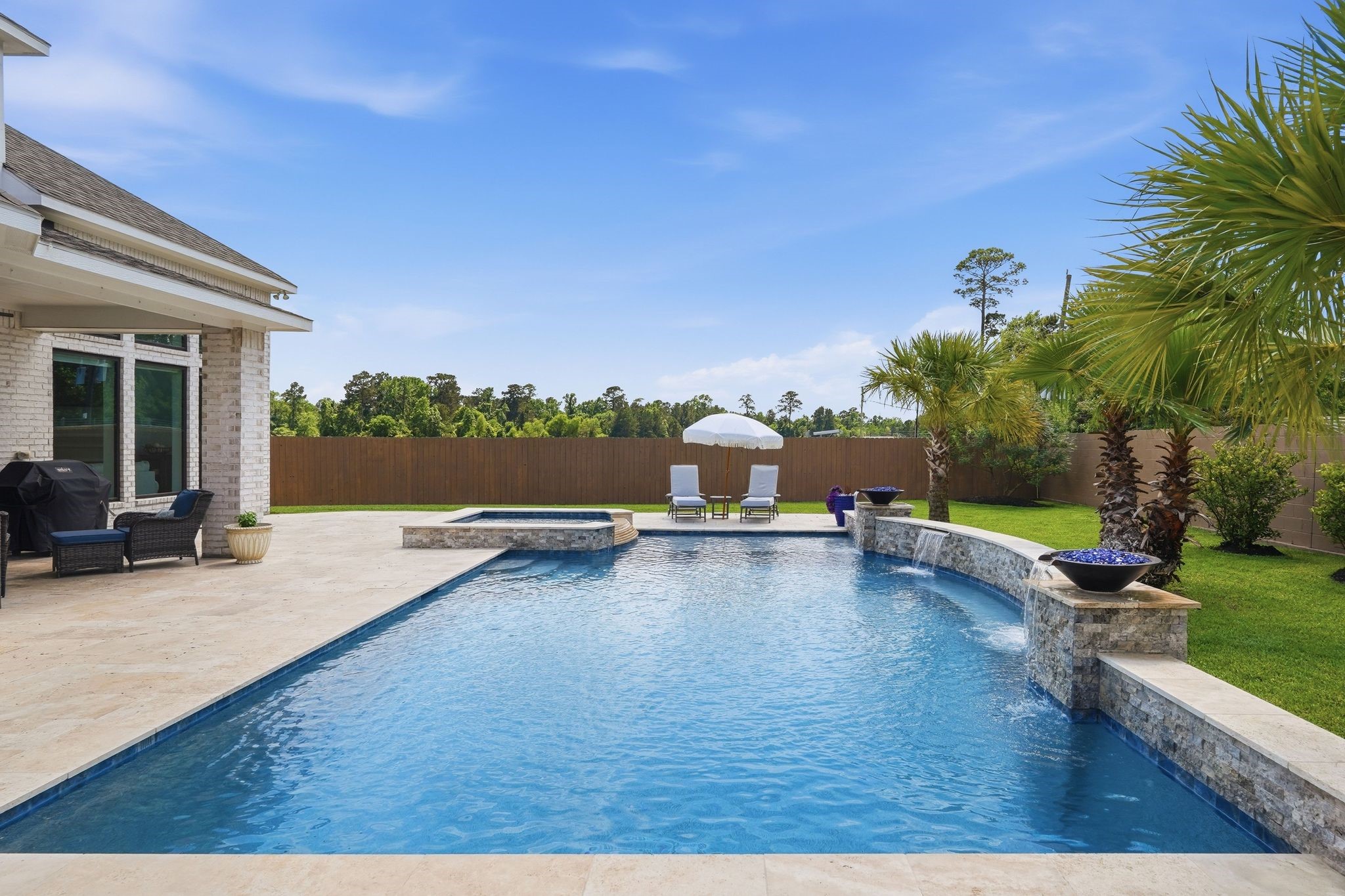 25011 Oxbow Lake Lane Spring, TX 77389 - Photo 27 of 33 a view of a swimming pool and lounge chair in the patio