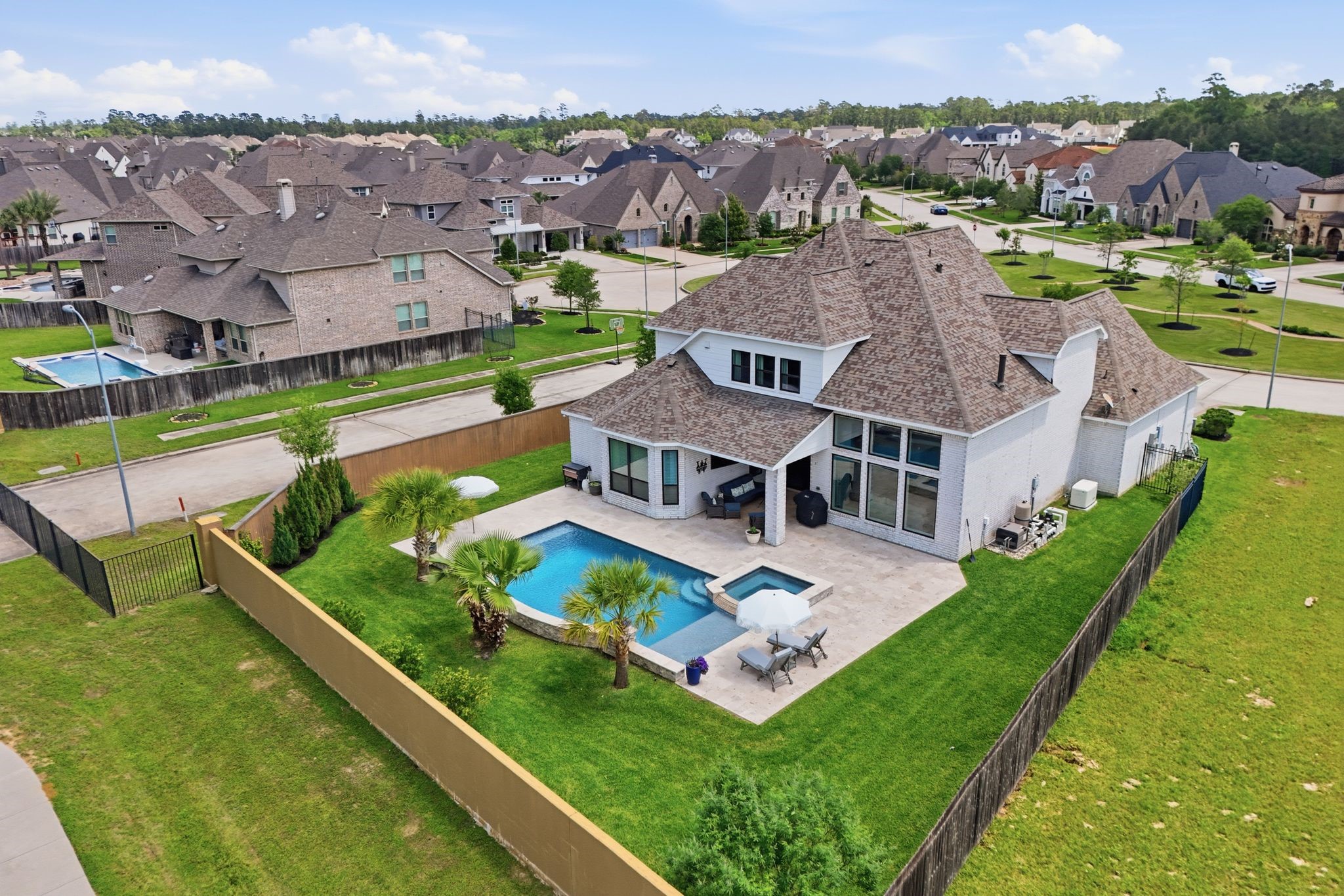 25011 Oxbow Lake Lane Spring, TX 77389 - Photo 31 of 33 an aerial view of residential houses with yard and lake view
