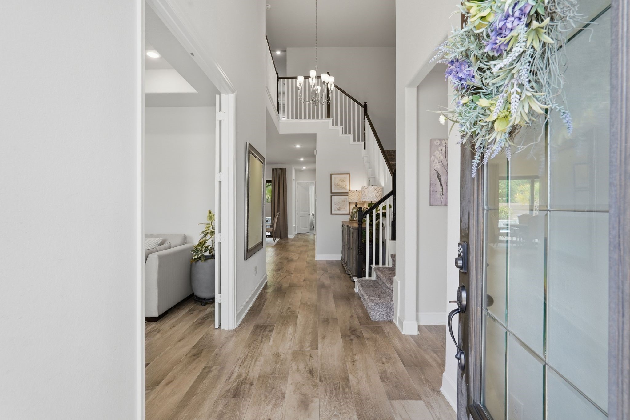 25011 Oxbow Lake Lane Spring, TX 77389 - Photo 4 of 33 a view of hallway with wooden floor and staircase