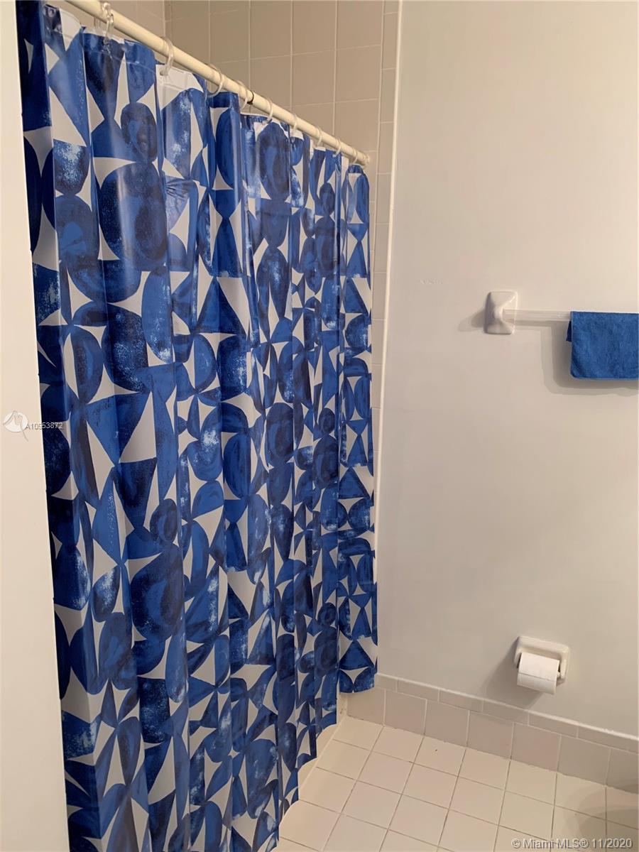 3915 Southwest 155th Avenue, Unit 313 Miramar, FL 33027 - Photo 7 of 10 a bathroom with a bathtub and a shower
