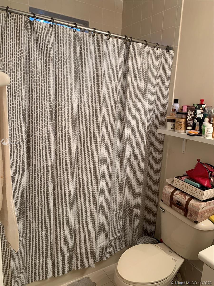 3915 Southwest 155th Avenue, Unit 313 Miramar, FL 33027 - Photo 8 of 10 a bathroom with a toilet and a sink