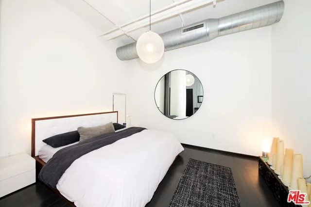 a bedroom with a bed and a table