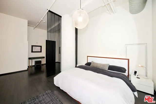 a living room with furniture a rug and a window