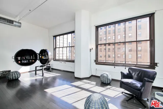 a room with furniture and a flat screen tv