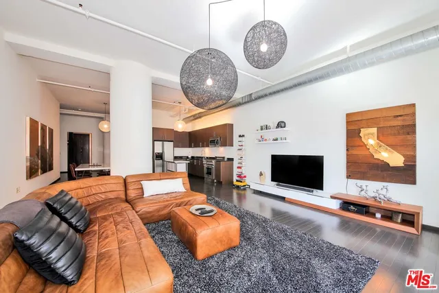 a living room with furniture a table and a fireplace