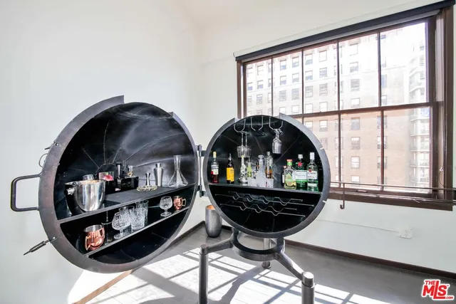 a kitchen with stainless steel appliances a stove a refrigerator and a microwave