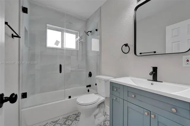 a bathroom with a toilet a sink and a bathtub
