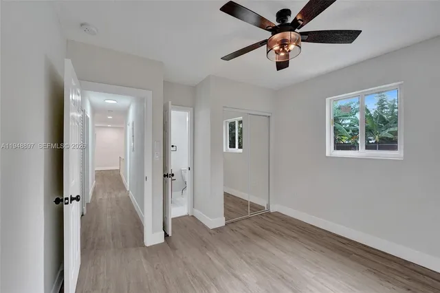 a bathroom with a toilet a sink and a mirror