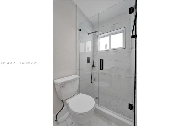 a view of kitchen with wooden floor and window
