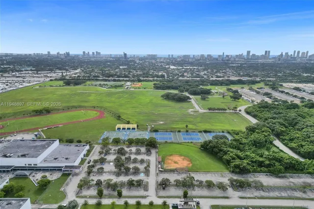 an aerial view of a house with a garden and plants