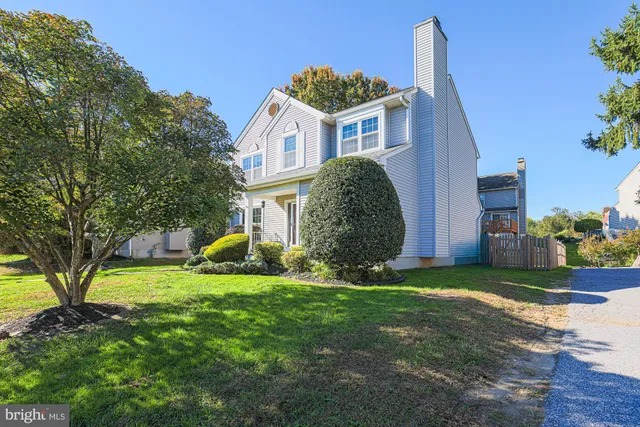 a view of balcony with wooden floor and fence