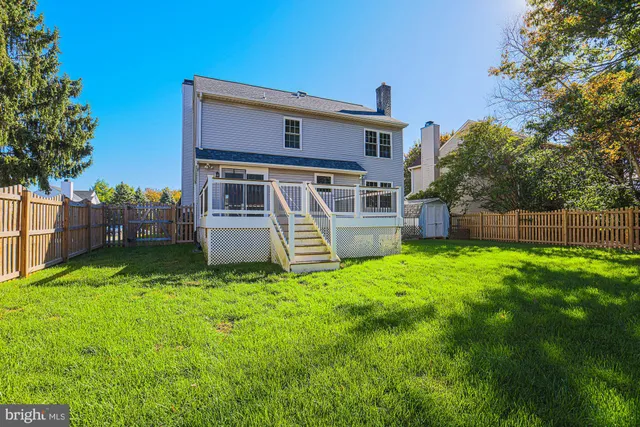 a front view of house with yard and outdoor seating