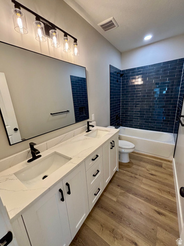 1184 West 3250 North Ogden, UT 84414 - Photo 43 of 69 Main bath dual vanity with white cabinetry, quartz countertop, and integrated sinks
