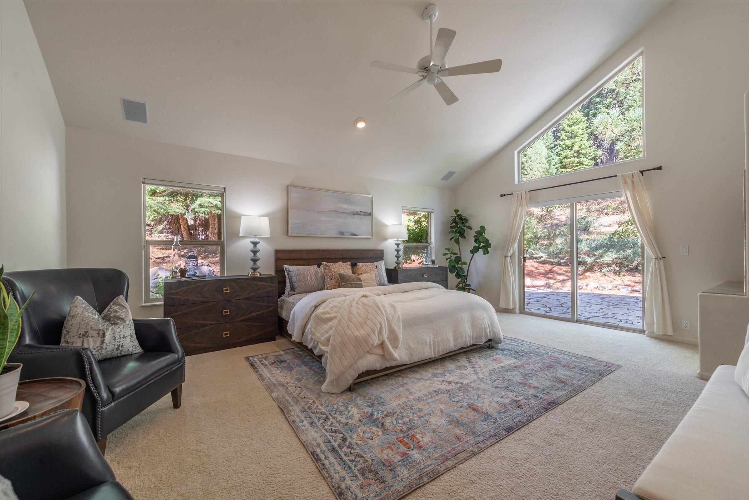 192 Hidden Lake Loop Olympic Valley, CA 96146 - Photo 11 of 21 a spacious bedroom with a large bed and a couch