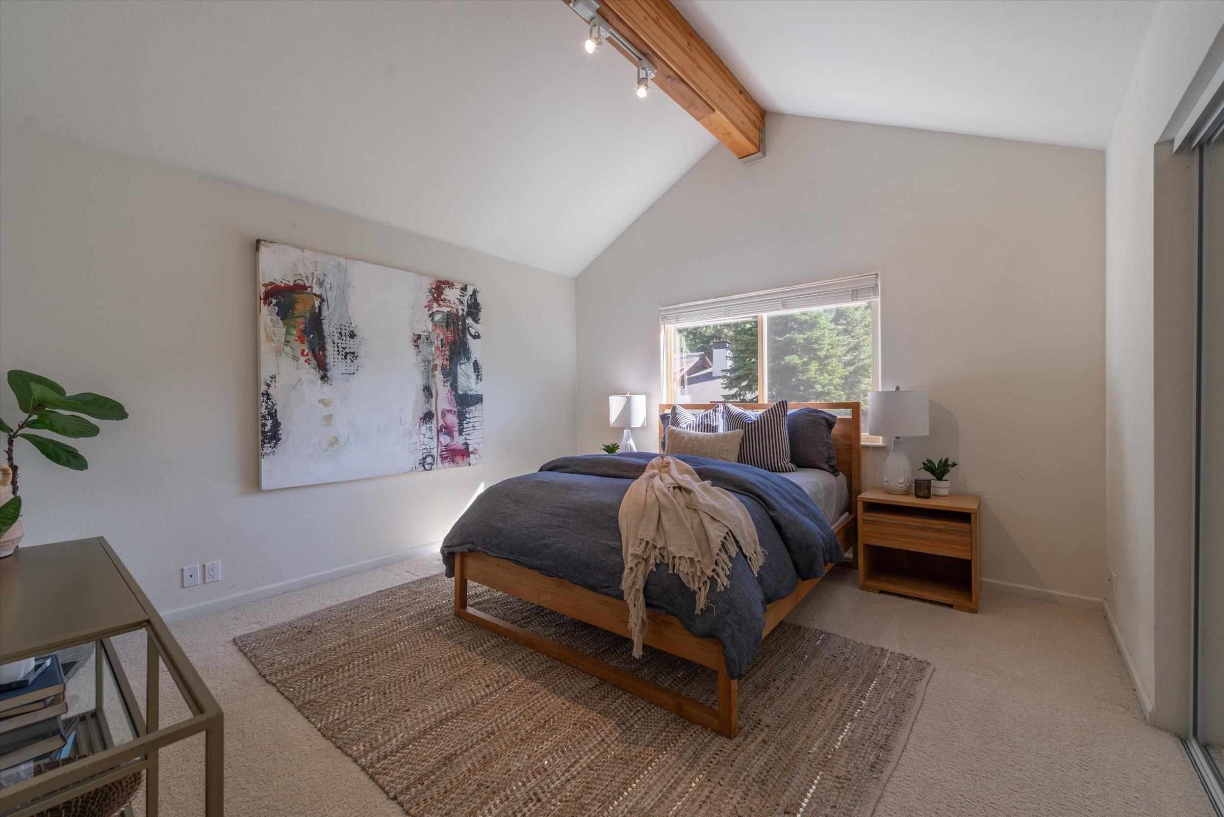 192 Hidden Lake Loop Olympic Valley, CA 96146 - Photo 16 of 21 a bedroom with a bed and a painting on the wall