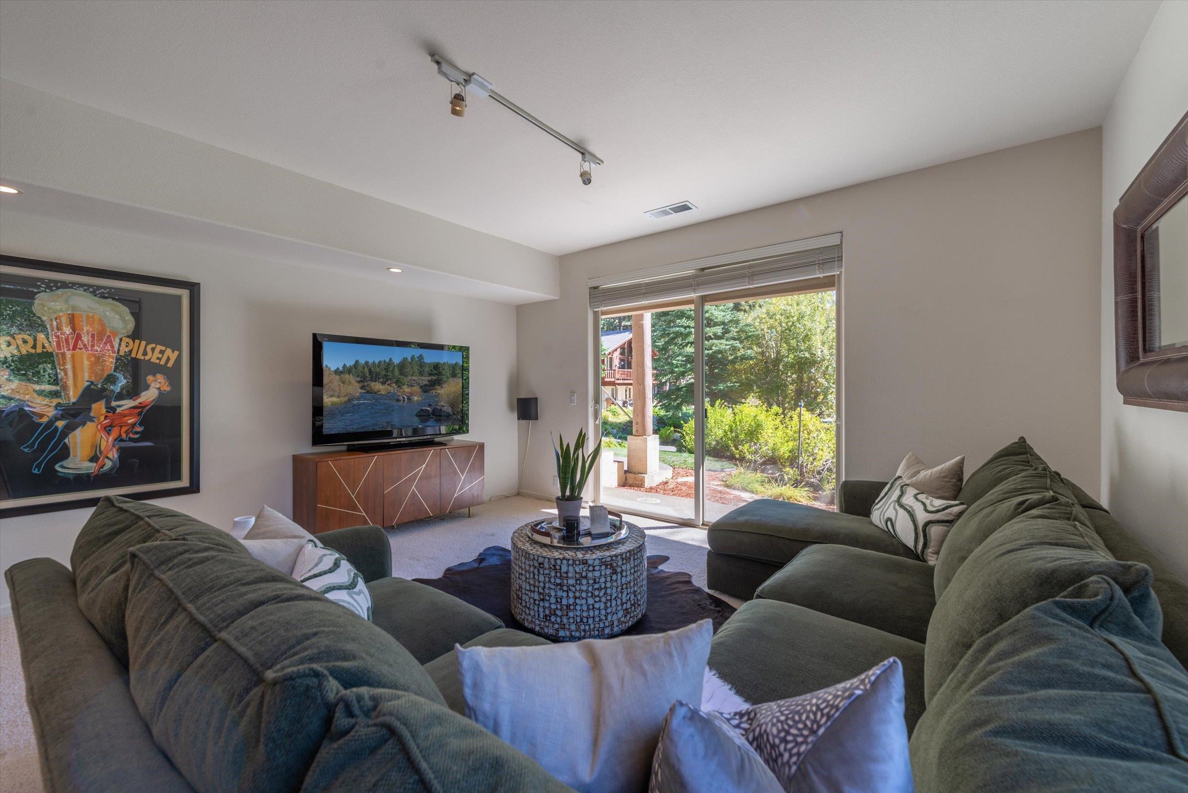 192 Hidden Lake Loop Olympic Valley, CA 96146 - Photo 18 of 21 a living room with furniture and a large window