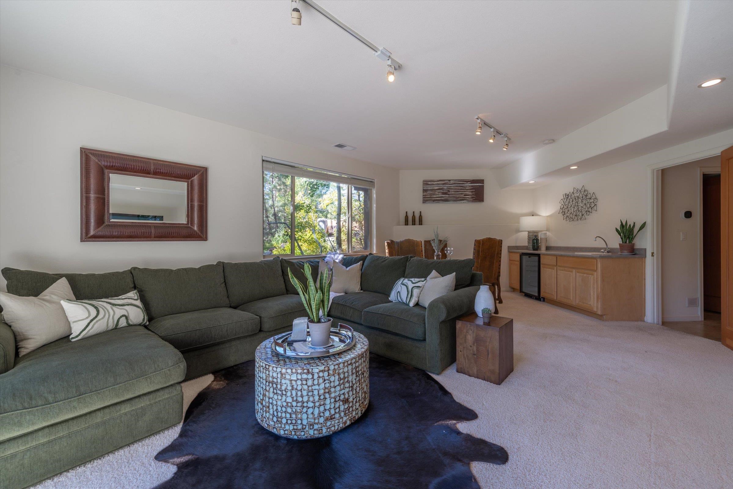 192 Hidden Lake Loop Olympic Valley, CA 96146 - Photo 19 of 21 a living room with furniture and a to ceiling window