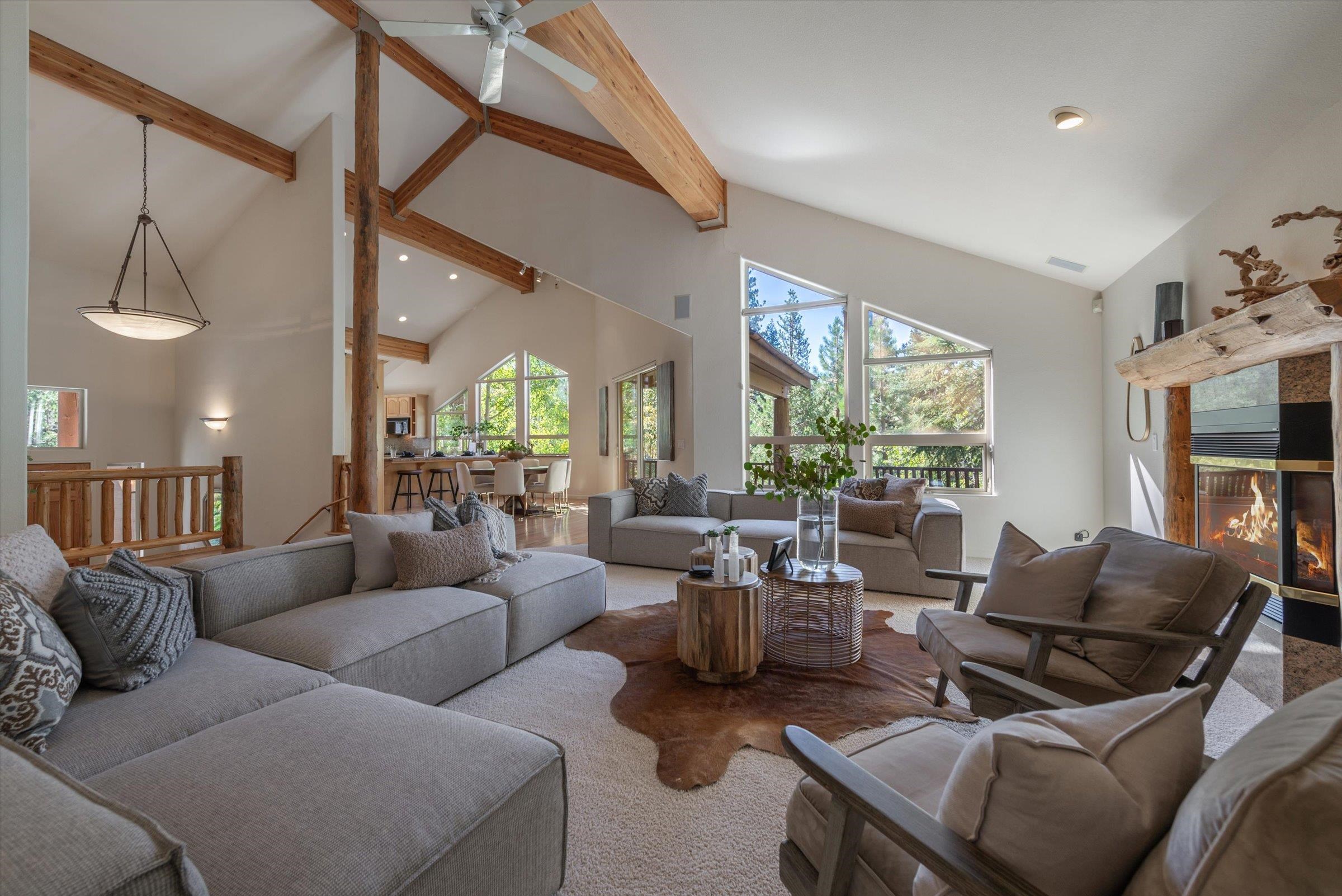192 Hidden Lake Loop Olympic Valley, CA 96146 - Photo 4 of 21 a living room with furniture fireplace and a large window