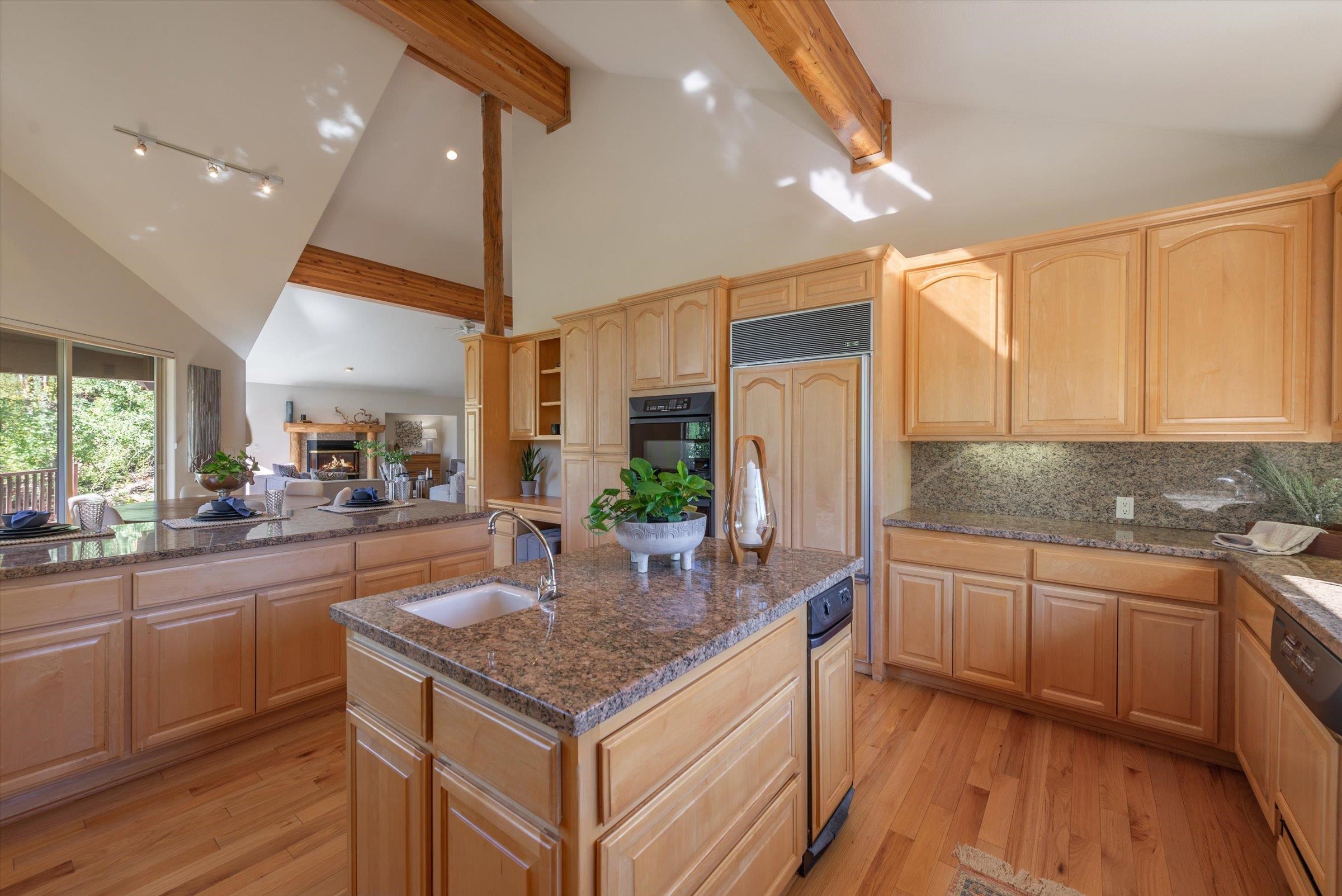 192 Hidden Lake Loop Olympic Valley, CA 96146 - Photo 9 of 21 a kitchen with granite countertop a sink and cabinets