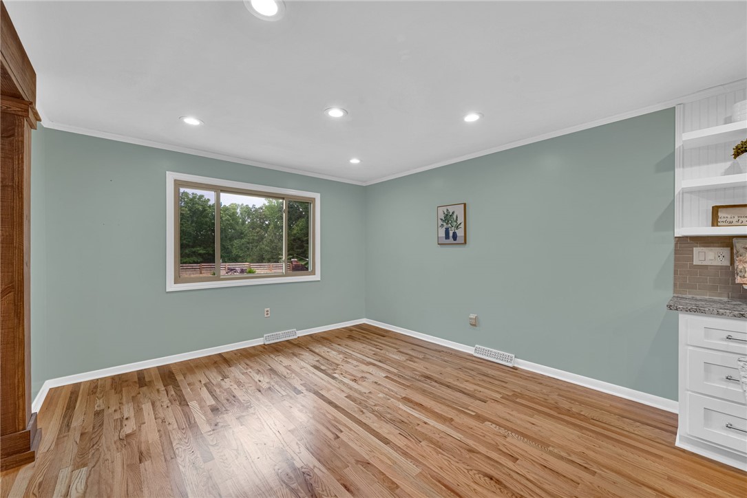 433 Latham Road Easley, SC 29640 - Photo 3 of 50 Hardwood floors and a wide window create a comfortable dining or living area.