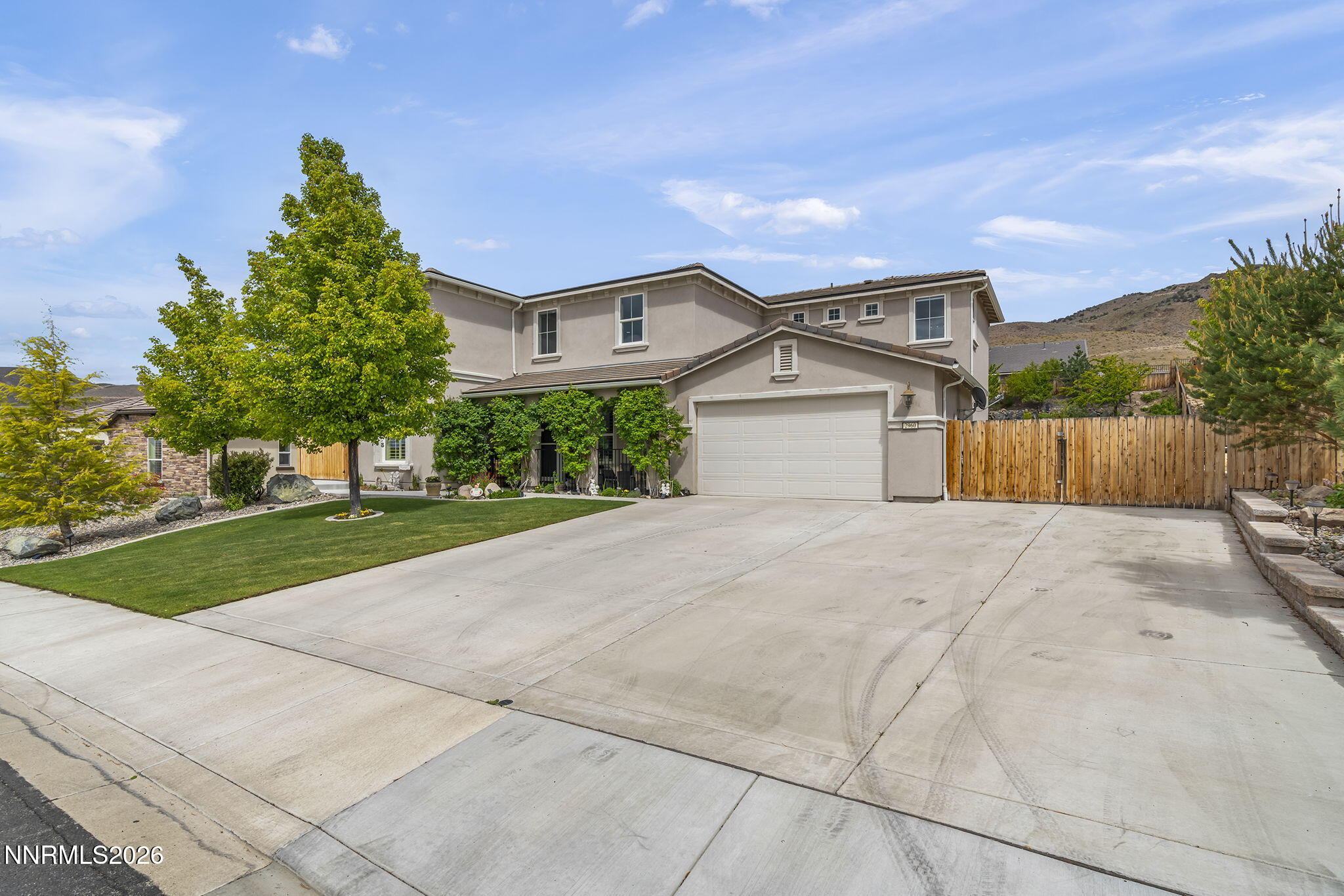 2960 Tobiano Drive Reno, NV 89521 - Photo 11 of 77 a front view of a house with a yard and garage
