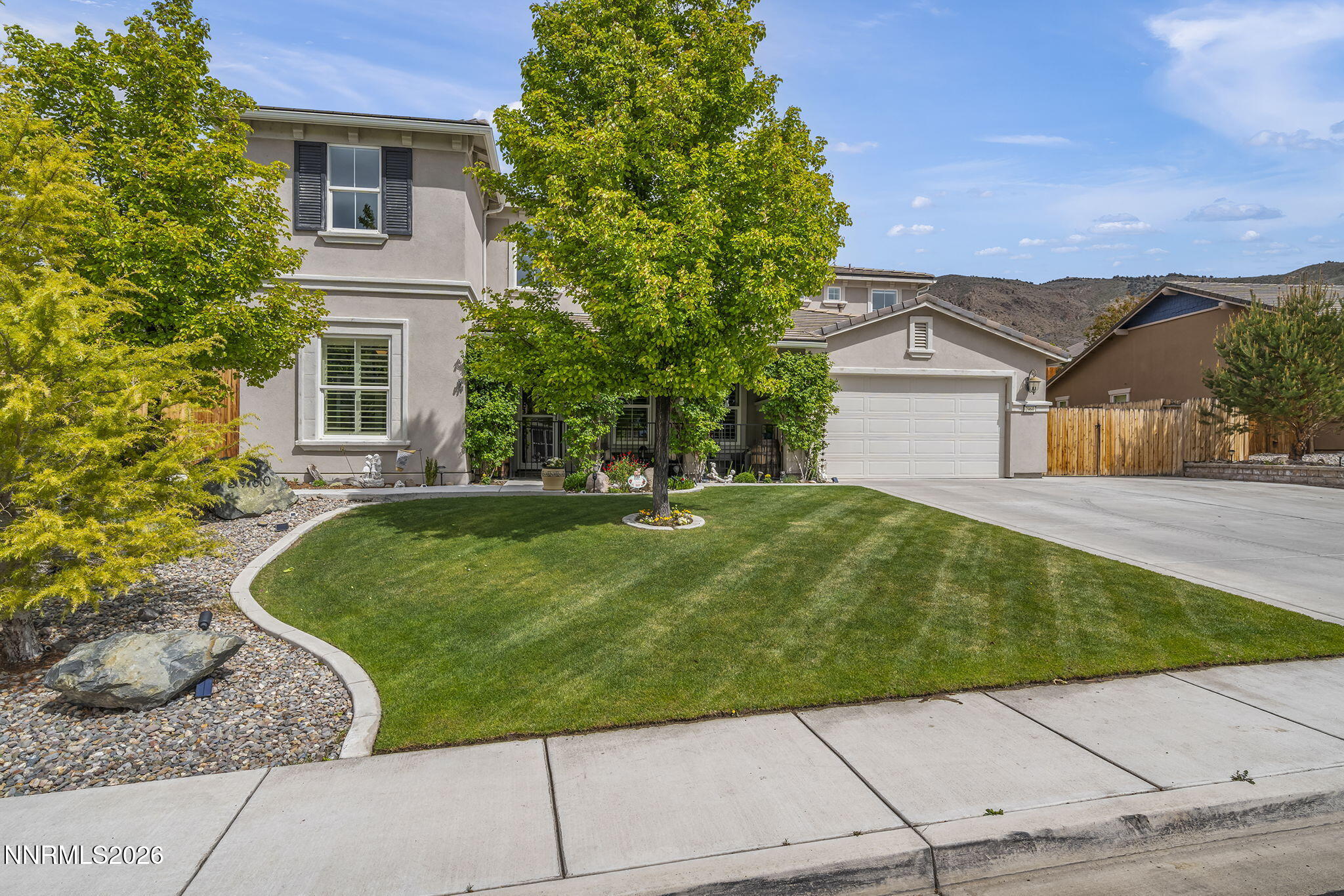 2960 Tobiano Drive Reno, NV 89521 - Photo 13 of 77 a house view with a garden space