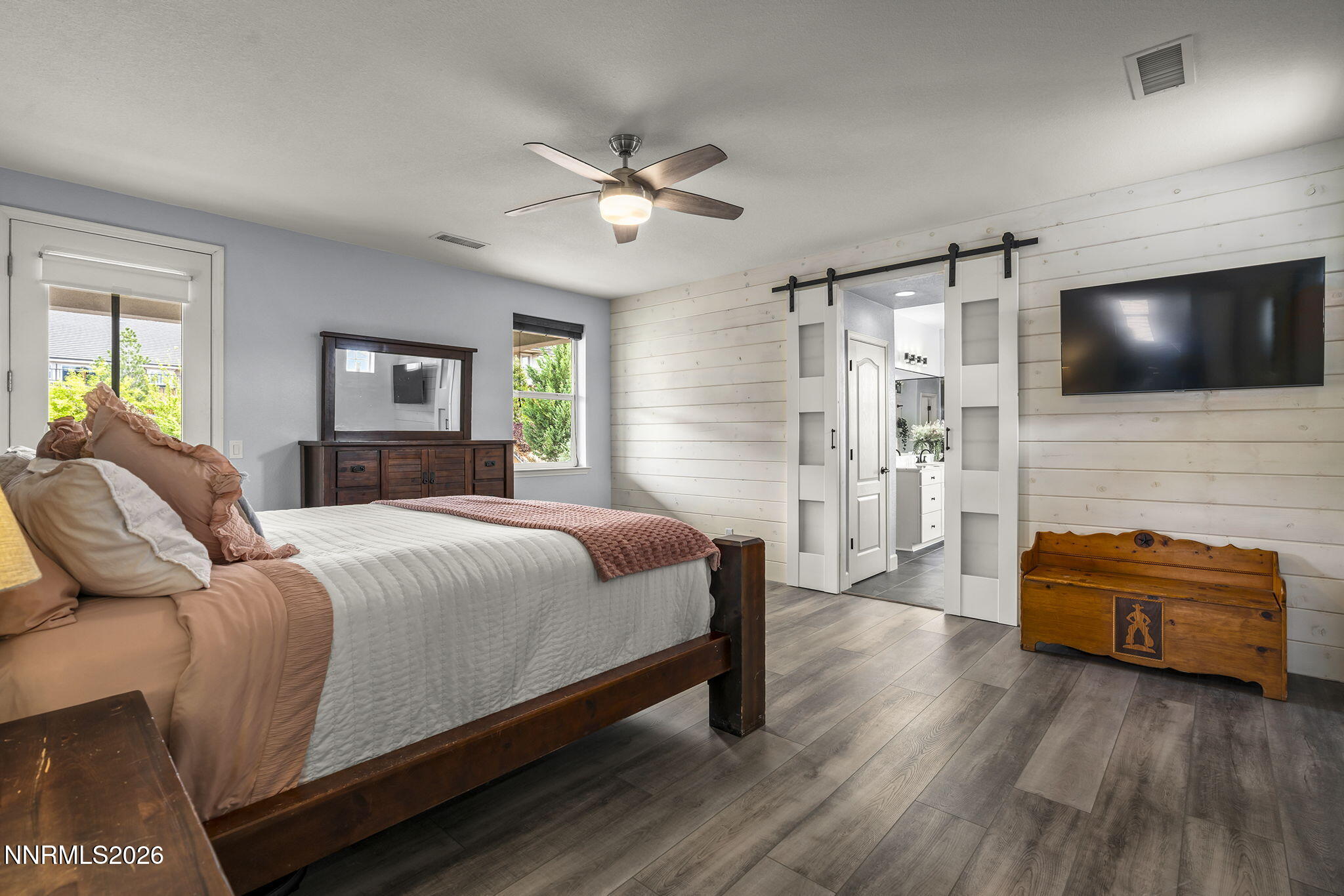 2960 Tobiano Drive Reno, NV 89521 - Photo 27 of 77 a bedroom with a bed and a flat screen tv