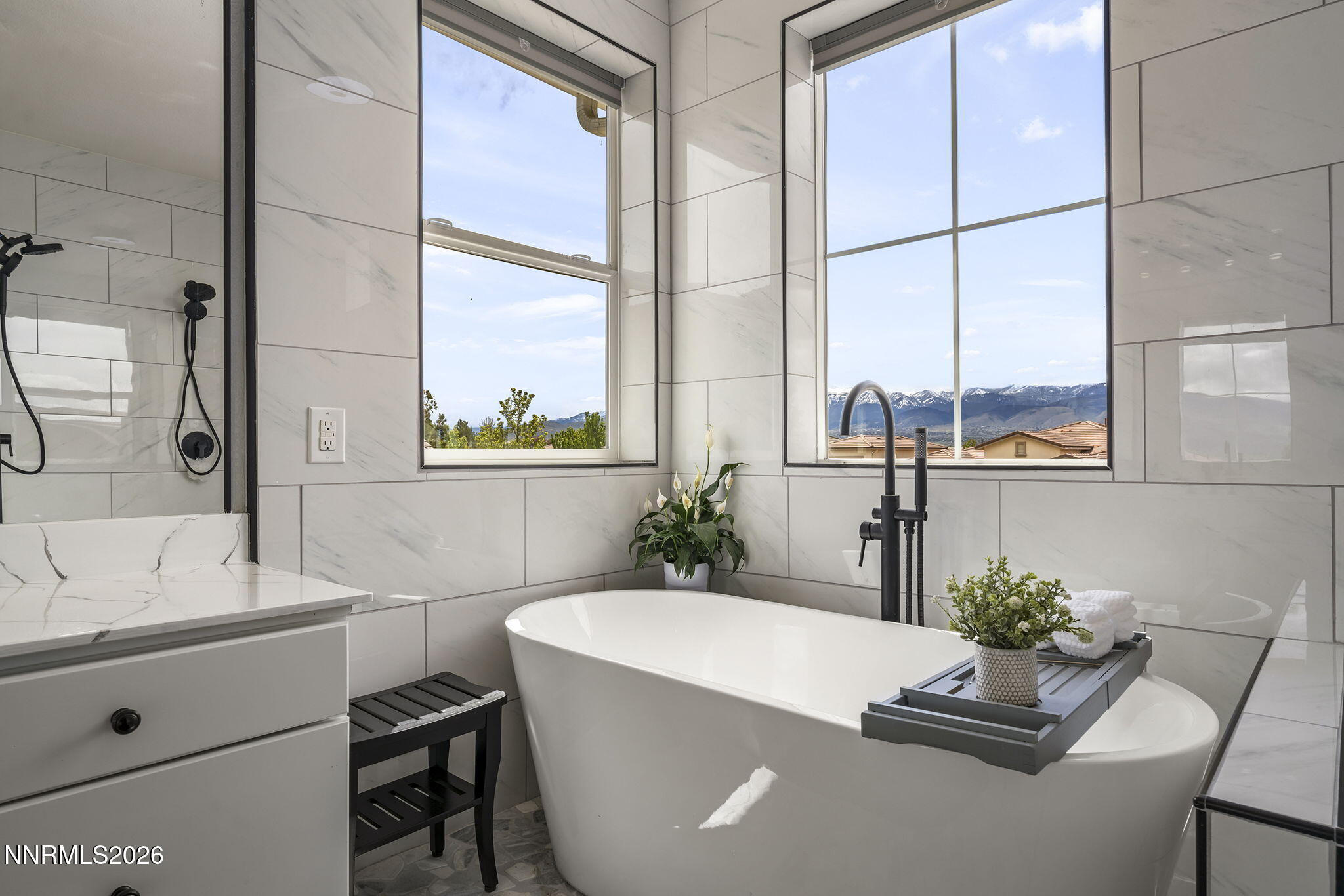 2960 Tobiano Drive Reno, NV 89521 - Photo 32 of 77 a living room with a large window and furniture