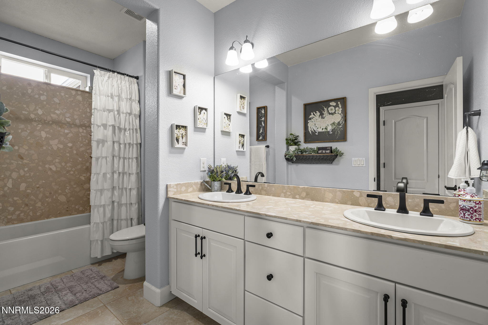 2960 Tobiano Drive Reno, NV 89521 - Photo 37 of 77 a bathroom with a double vanity sink toilet and shower
