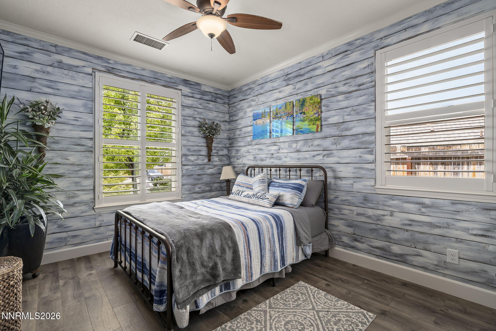 2960 Tobiano Drive Reno, NV 89521 - Photo 39 of 77 a bedroom with a bed next to a window and a potted plant