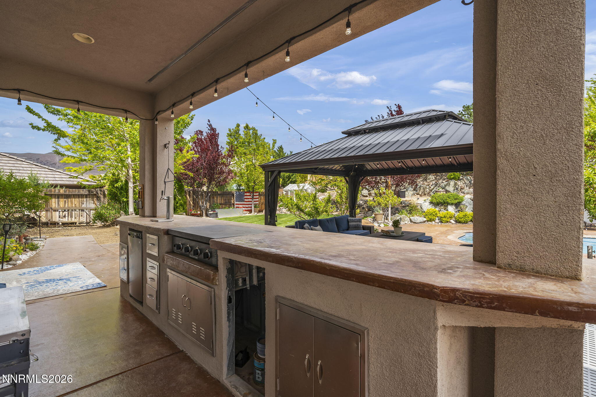 2960 Tobiano Drive Reno, NV 89521 - Photo 43 of 77 a kitchen with a stove and a large window