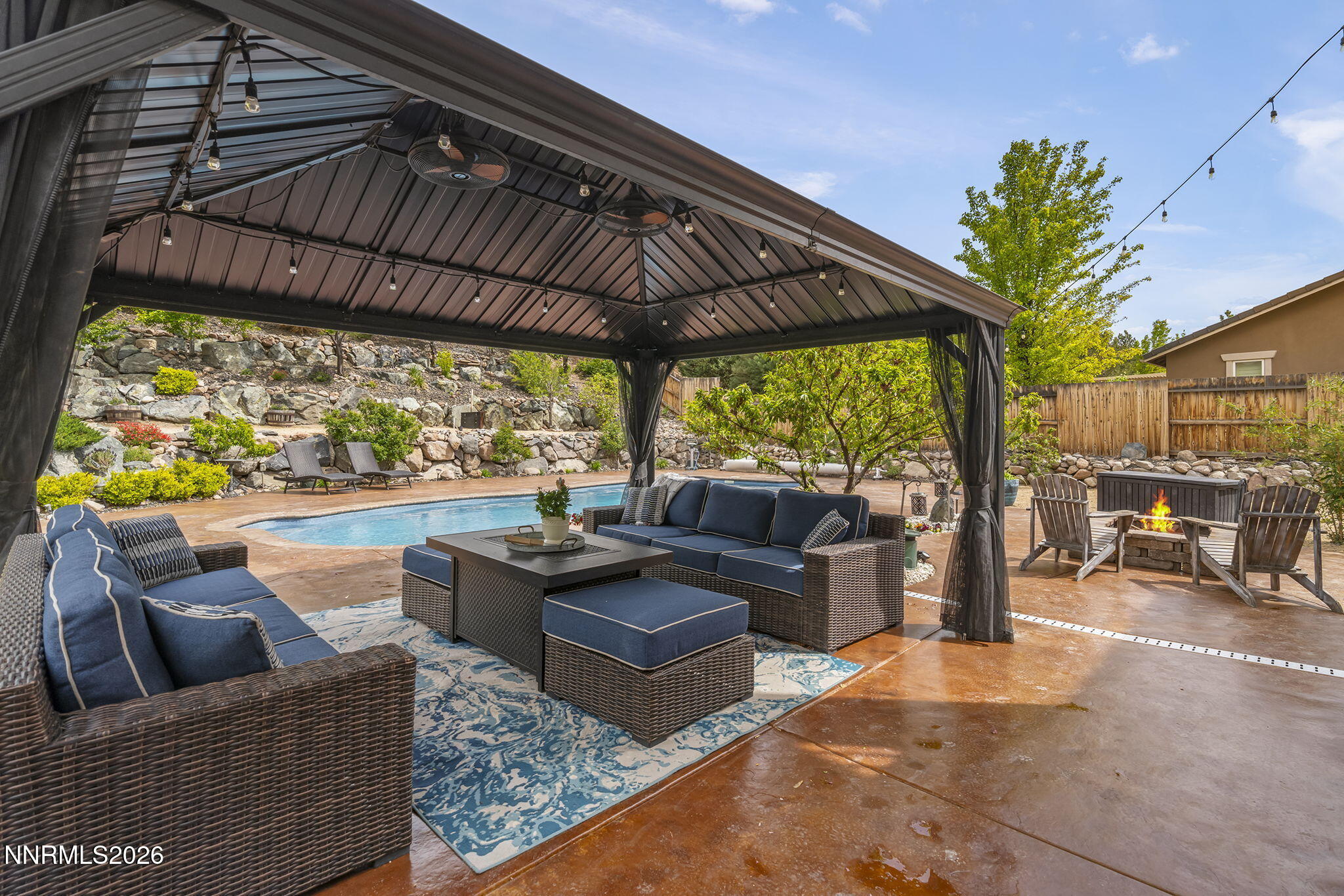 2960 Tobiano Drive Reno, NV 89521 - Photo 45 of 77 a outdoor living space with patio furniture and a potted plant