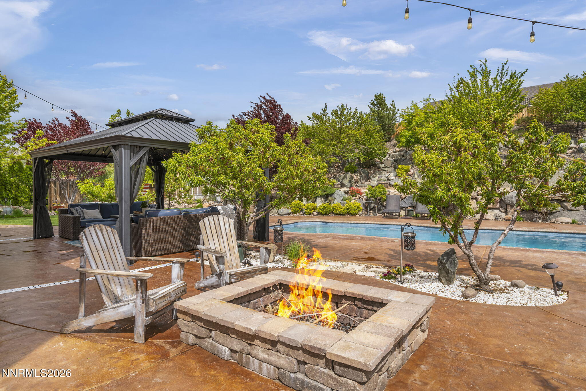 2960 Tobiano Drive Reno, NV 89521 - Photo 46 of 77 a view of a backyard with sitting area and furniture