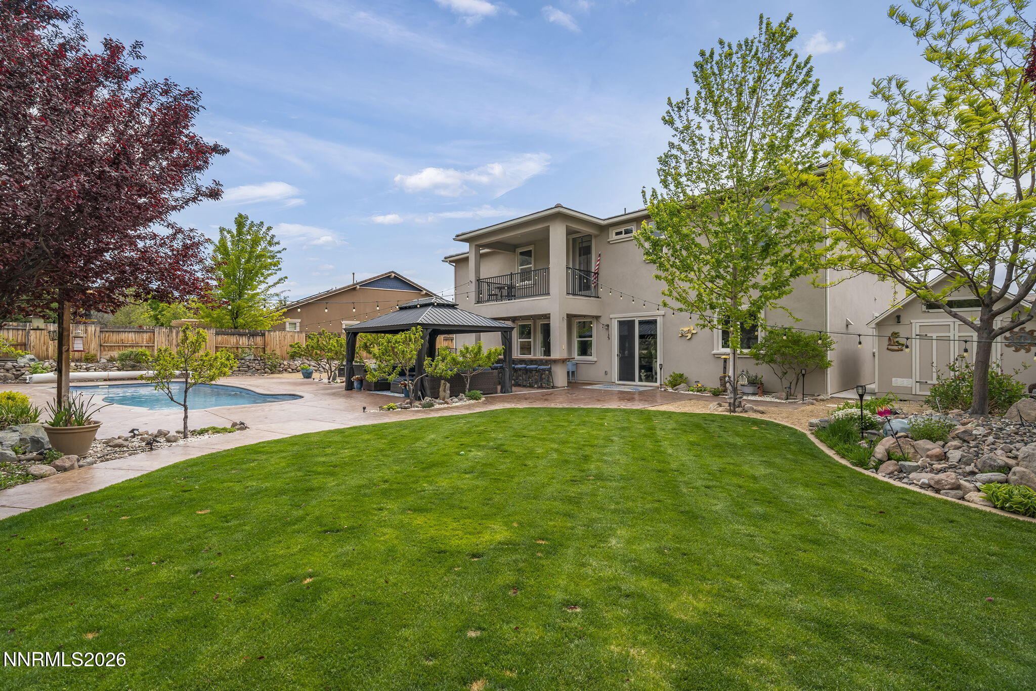 2960 Tobiano Drive Reno, NV 89521 - Photo 47 of 77 a front view of a house with garden