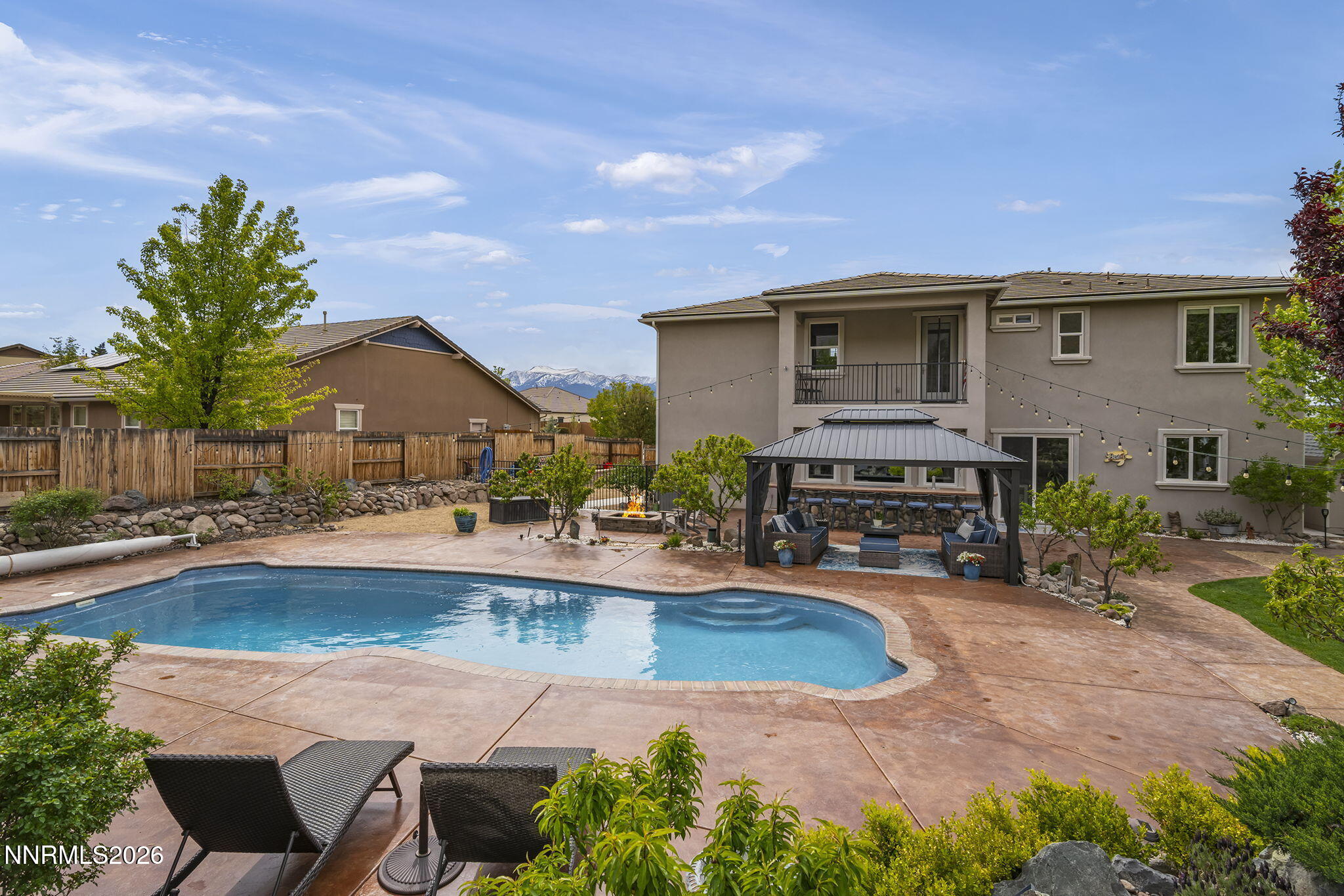 2960 Tobiano Drive Reno, NV 89521 - Photo 50 of 77 a view of a house with swimming pool and sitting area