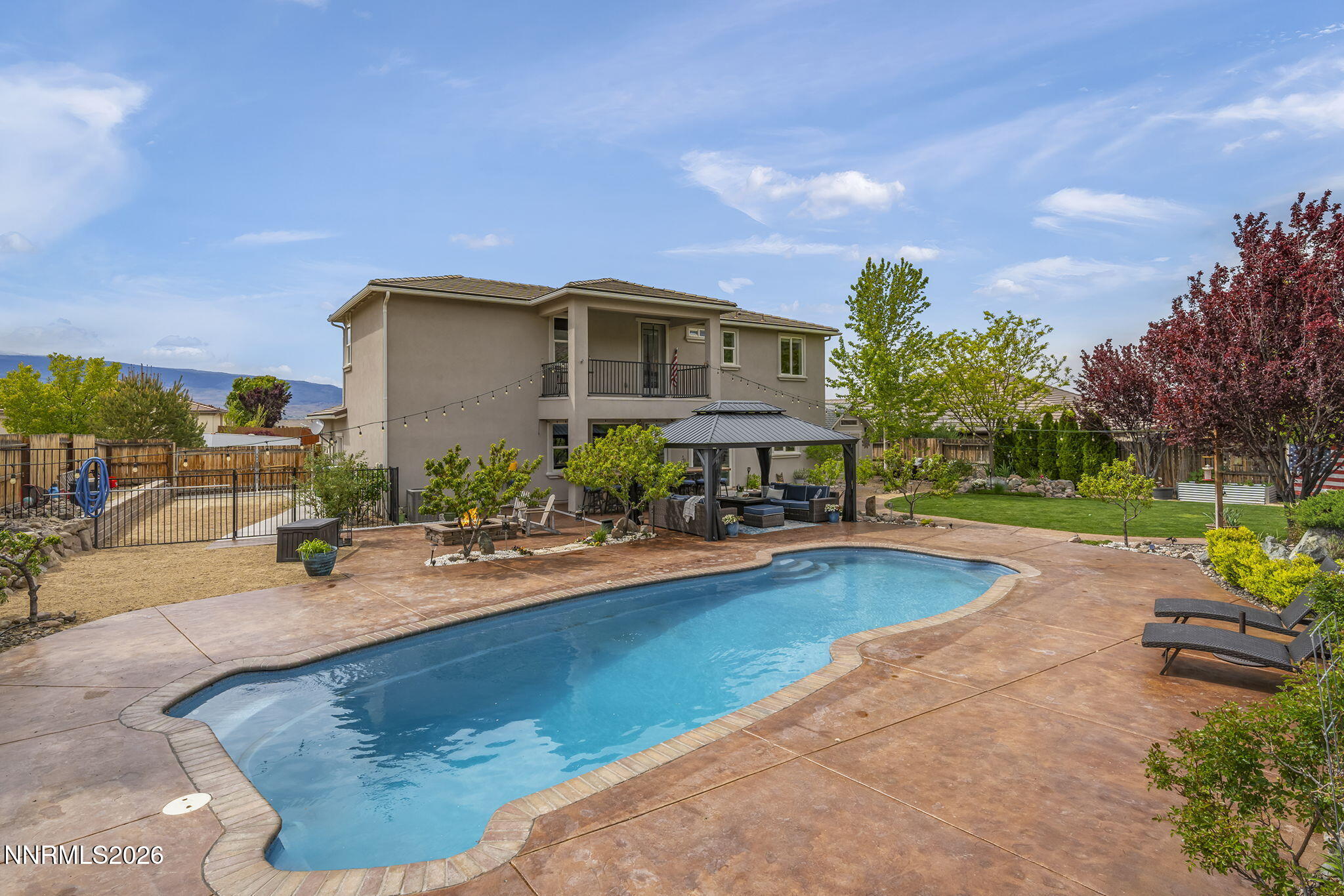 2960 Tobiano Drive Reno, NV 89521 - Photo 51 of 77 a view of a house with swimming pool and sitting area